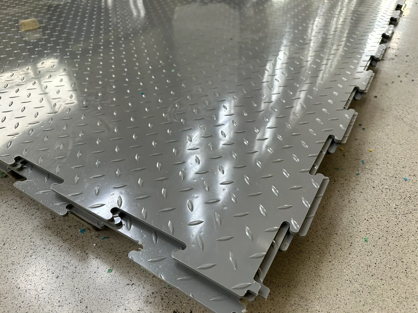 Company-supplied factory photo: grey HDPE panel with interlocking edge.